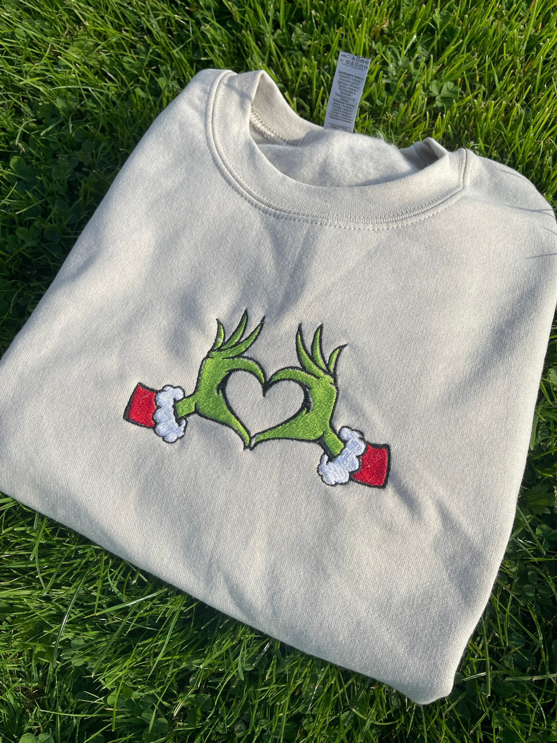Grinch Heart Hands Embroidered Sweatshirt Crewneck Grinch Heart Hands Embroidered Sweatshirt Crewneck